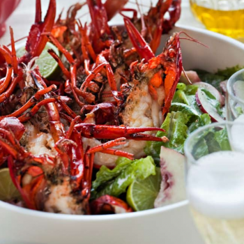 Garlic fried crayfish with peach and baby cos salad and buttermilk dressing