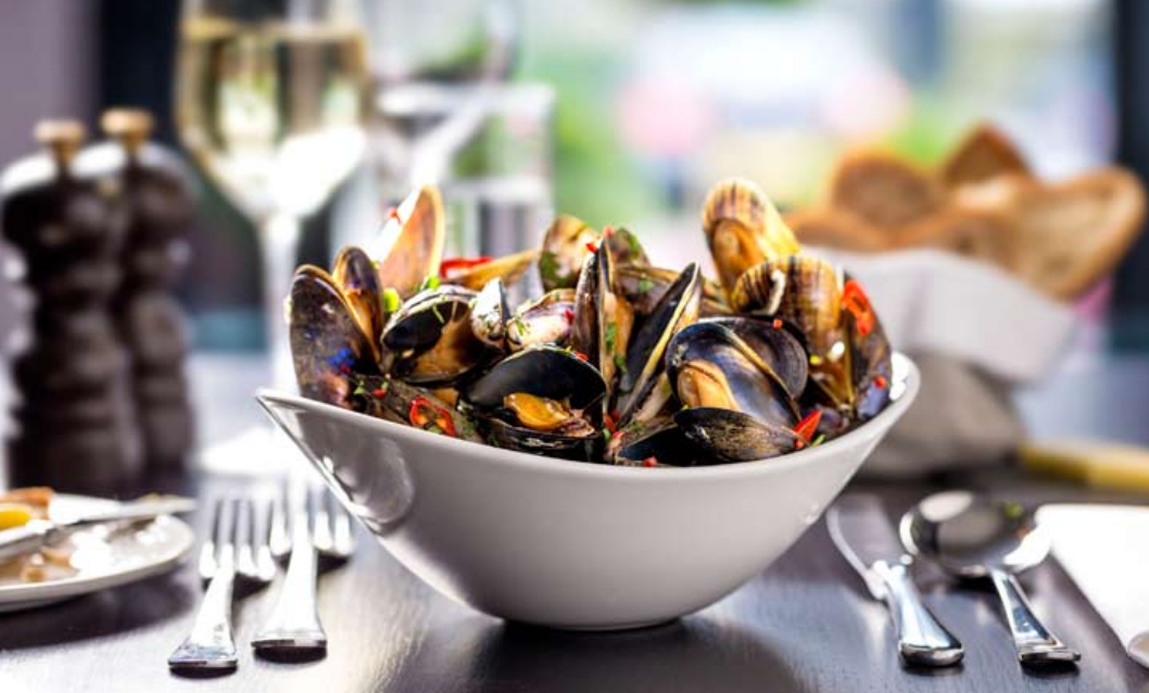 Josper grilled Shetland mussels with cider, tarragon and cream