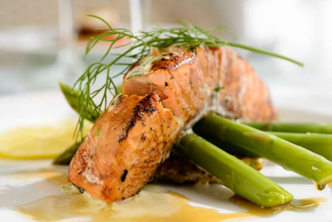 Pan-seared maple-glazed ocean trout, leek pancake, braised fennel, pan-tossed asparagus, and dill cream